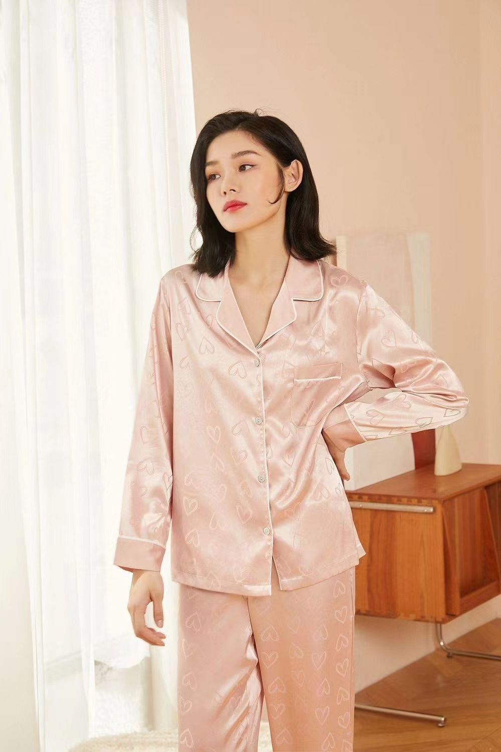 Cozy & Cute: Girls' Pink Silky Pajamas with Heart Print