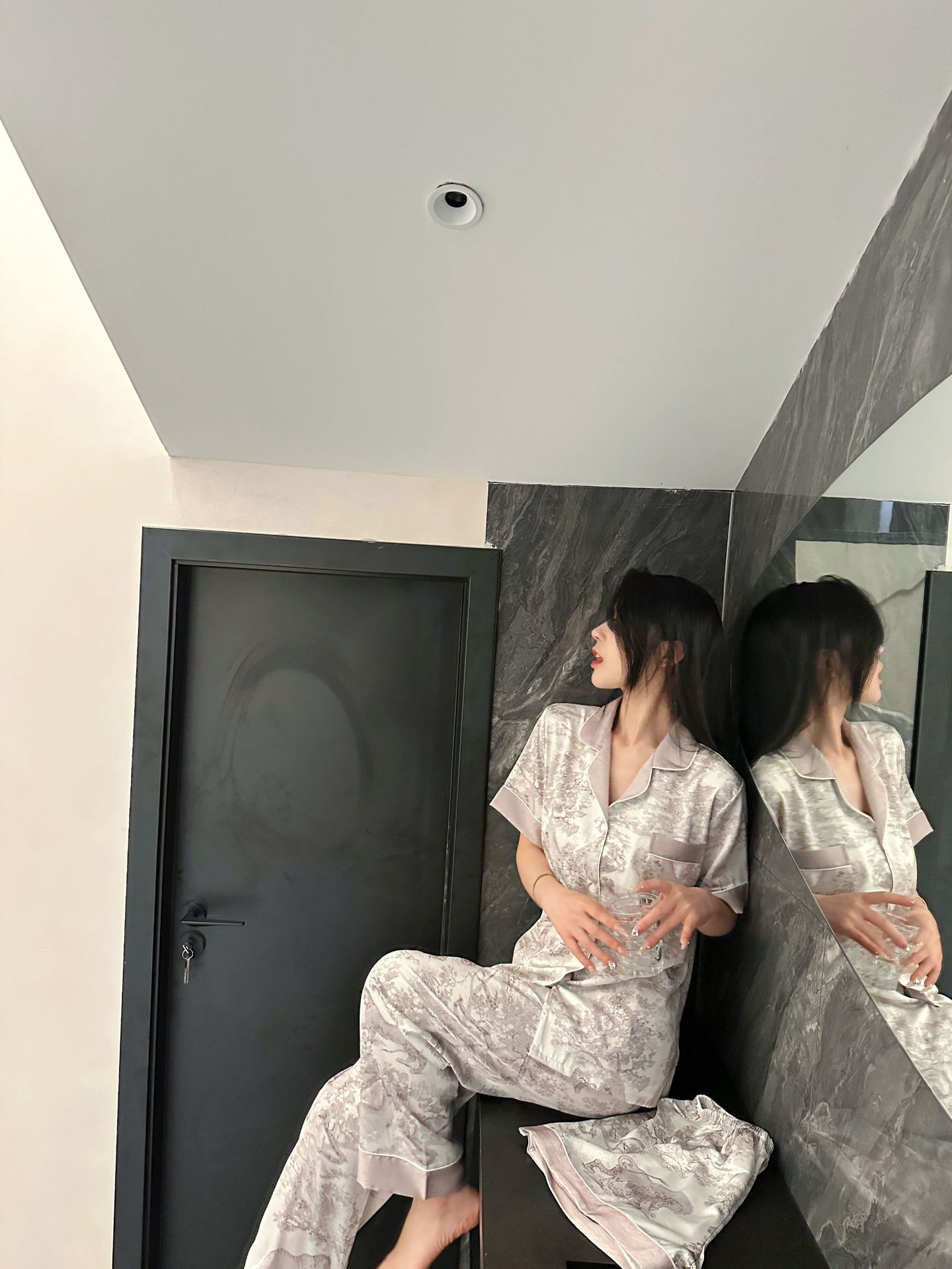 Indulge in ultimate comfort with our luxurious gray ice silk pajama set. Designed for a slimming fit, this 3-piece set features breathable fabric and a stylish design. Perfect for a restful night's sleep.