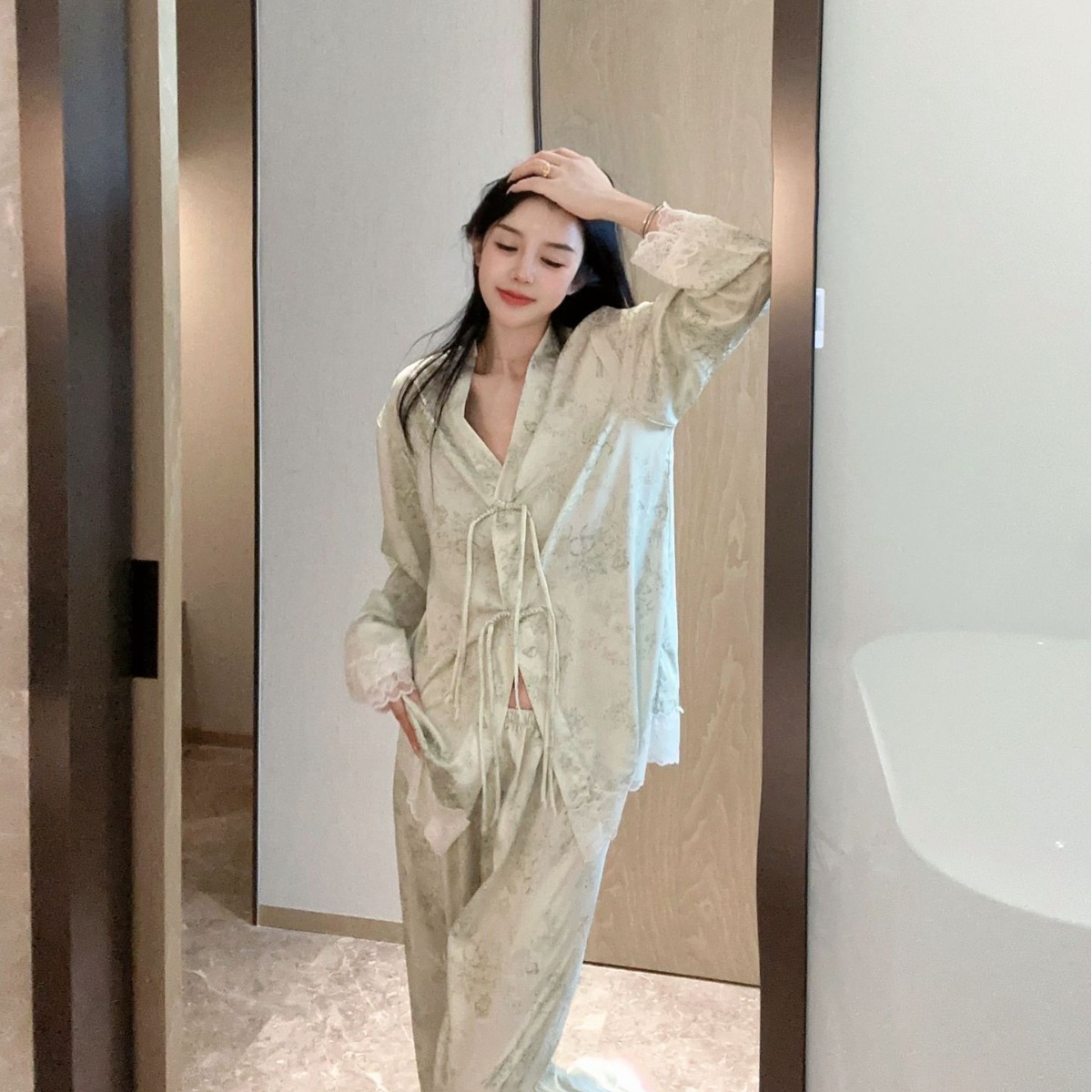 Experience ultimate comfort with our women's spring/autumn pajama set made from soft ice silk fabric. The floral print and Chinese knot details add a touch of elegance.